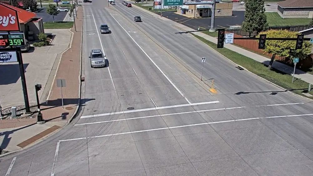 A screenshot of traffic camera footage showing two vehicles (top of image) crashing at 25th Street South and the tail end of the off ramp from I-94 eastbound on June 28 2025
