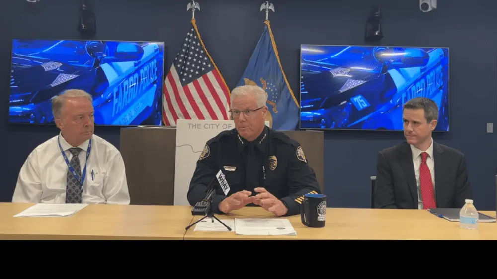 Image of Fargo Mayor Tim Mahoney (left) Police Chief David Zibolski (center) and City Administrator Michael Redlinger (right)