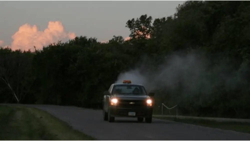 Image of truck mounted spraying in action on the road