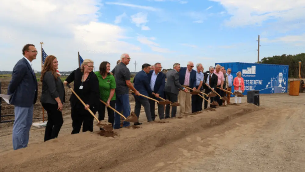 Image of people holding shovels posing for photos at the groundbreaking ceremony