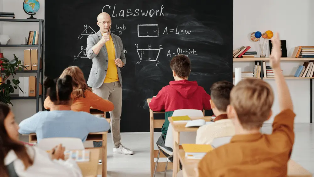 Image of teacher with students