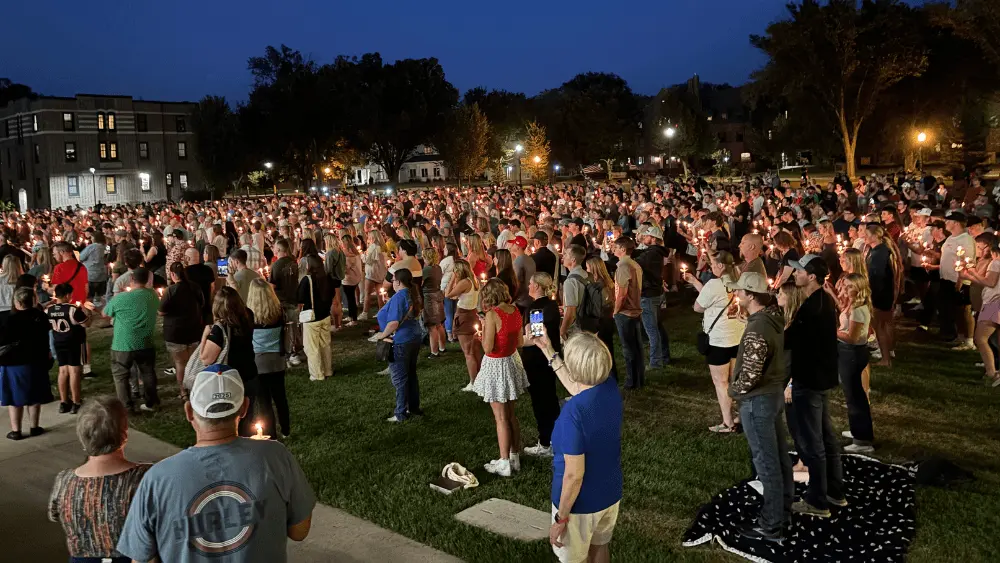 people holding candles