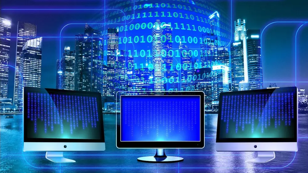 three computer monitors