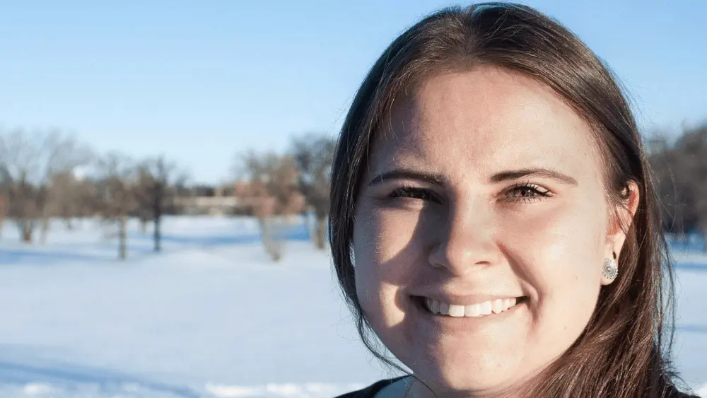 a woman standing in snow