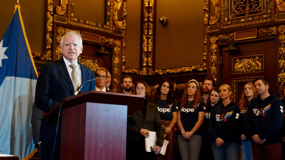 man addresses with people watching