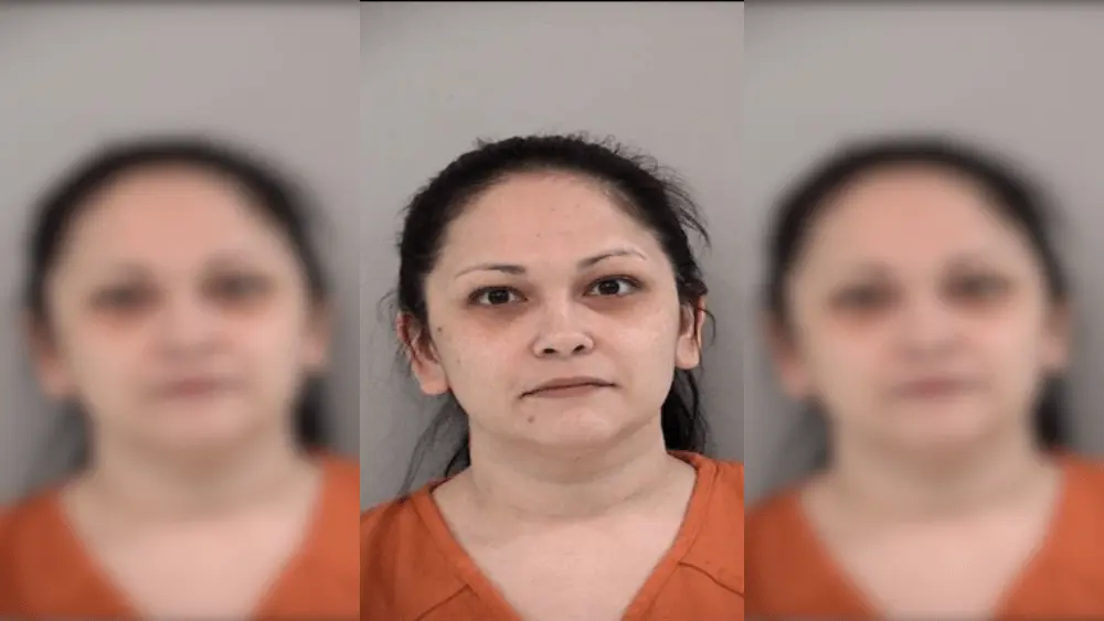 A woman in an orange shirt