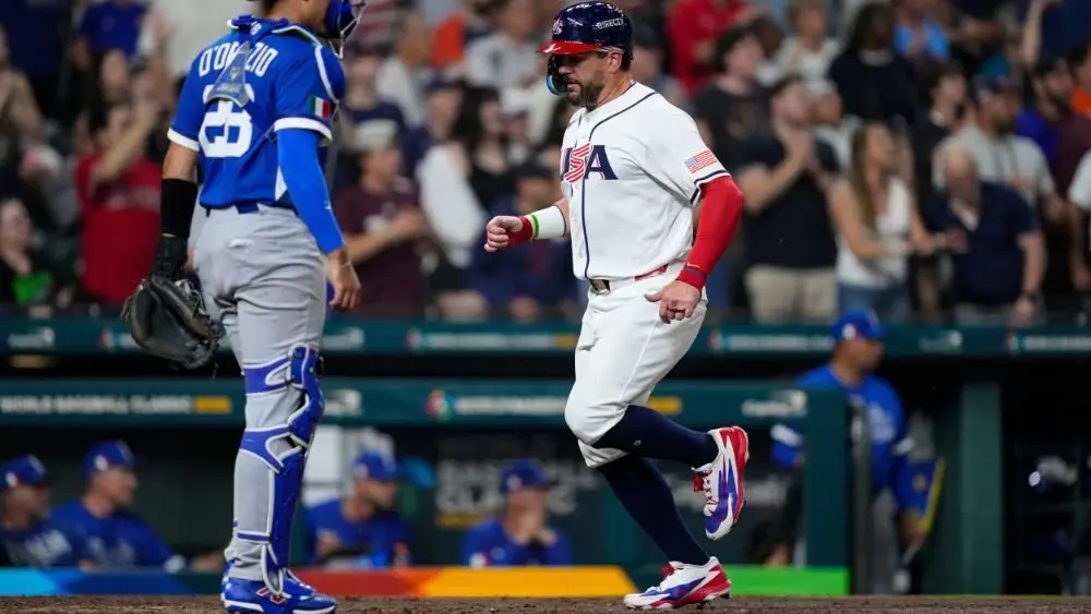 Team USA Baseball's Kyle Schwarber scoring a run