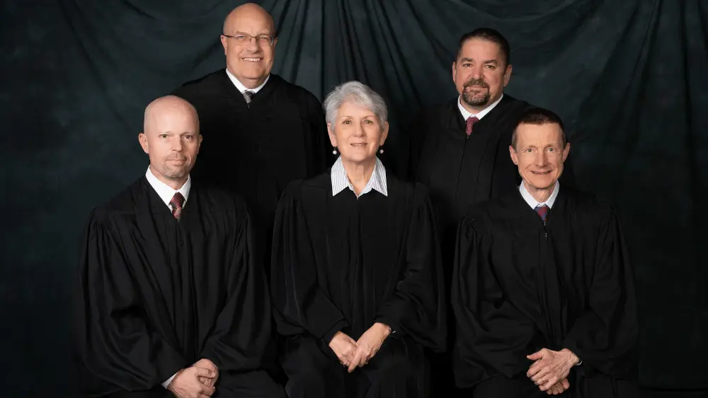 men and women in black robes