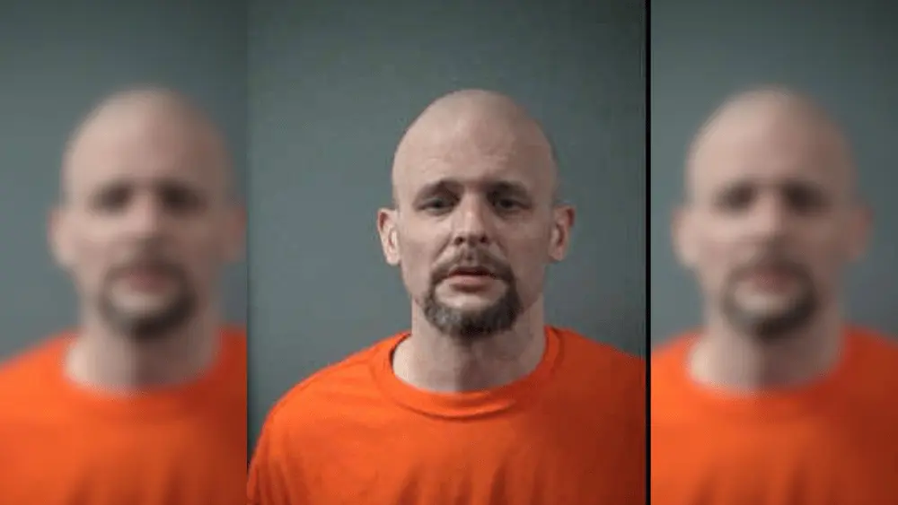 a man in an orange shirt