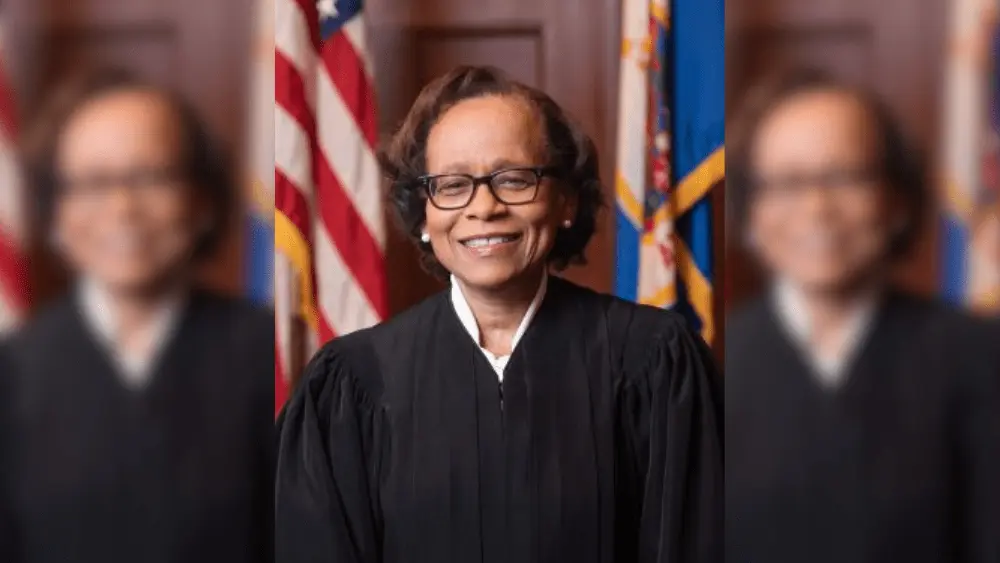 a woman in a black robe