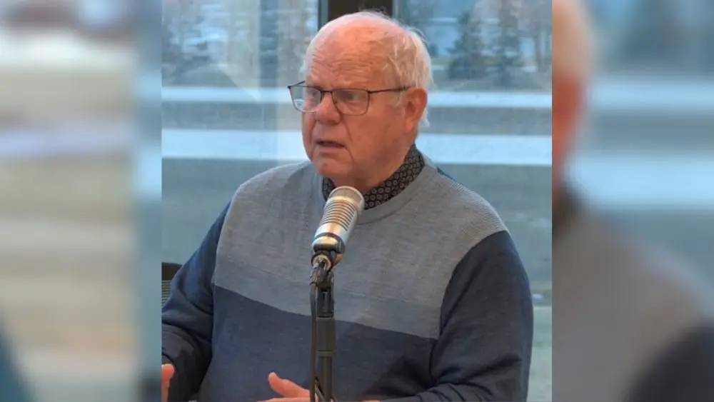 Moorhead Spuds broadcaster Larry Knutson having a conversation
