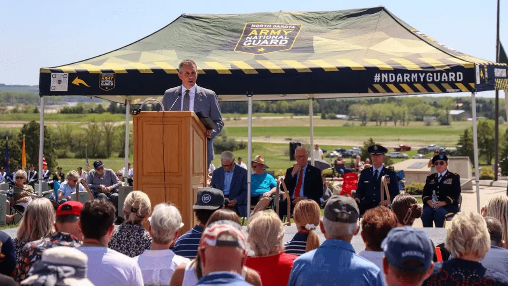 a man speaking at a podium