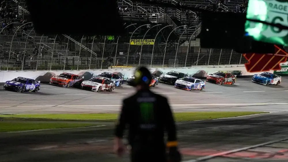 cars driving by in a NASCAR race