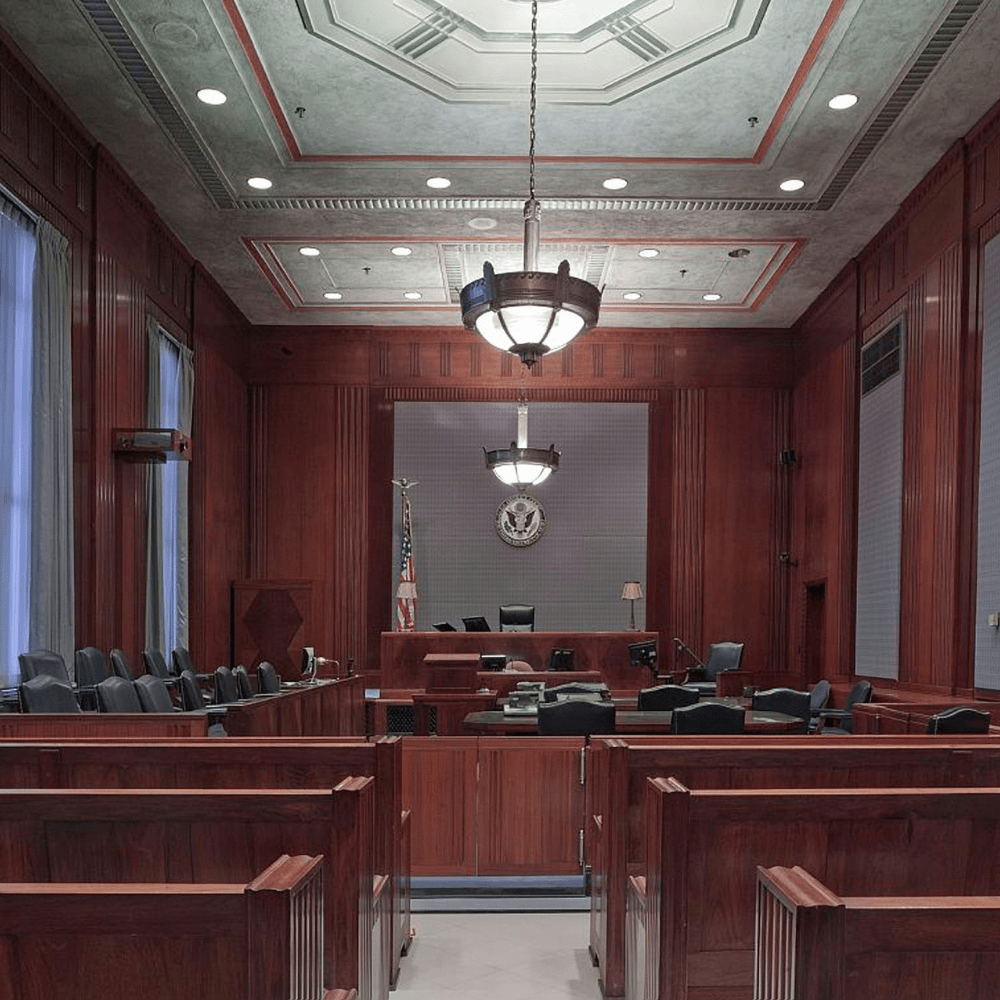 An empty courtroom centered on the judge's bench