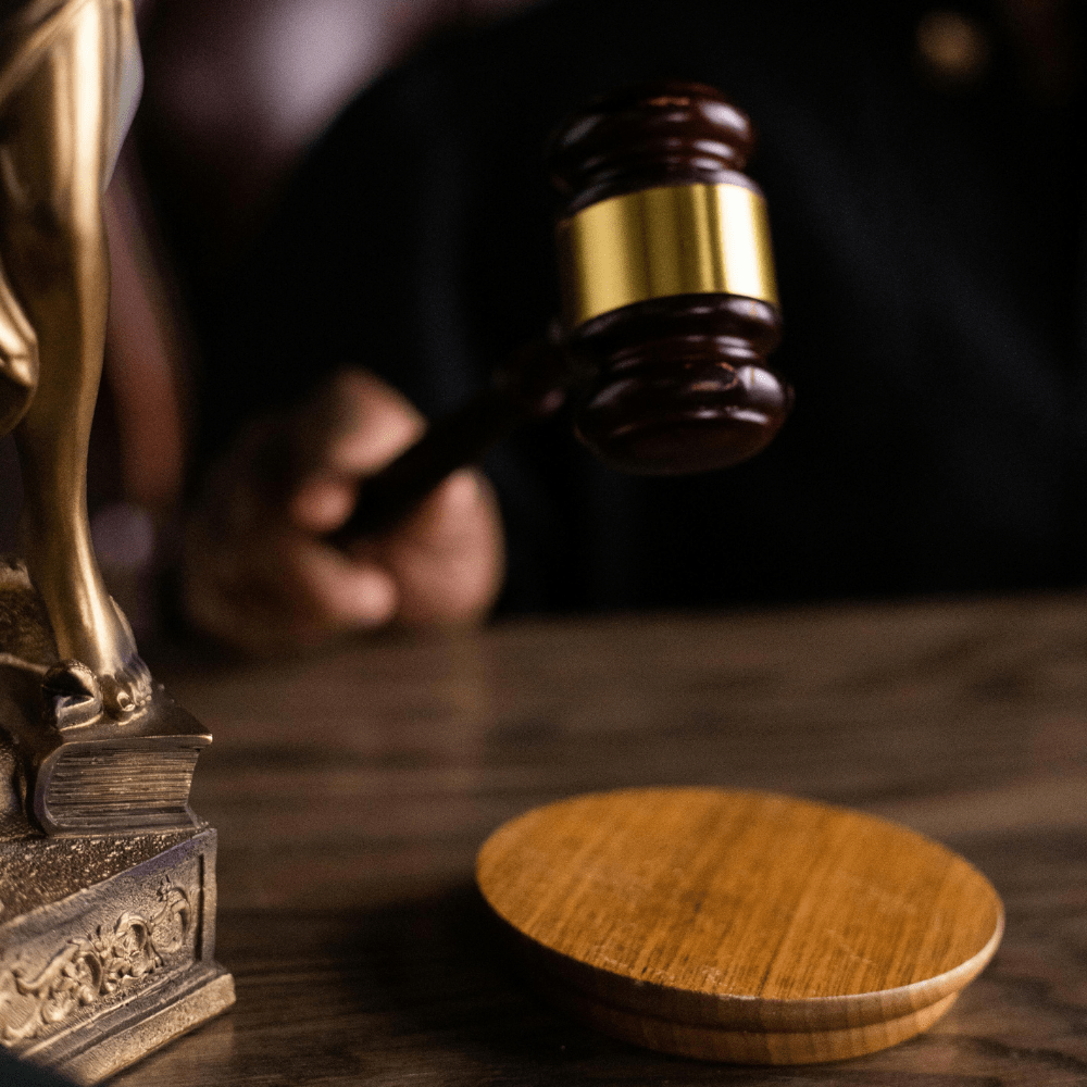 Person holding gavel in a courtroom