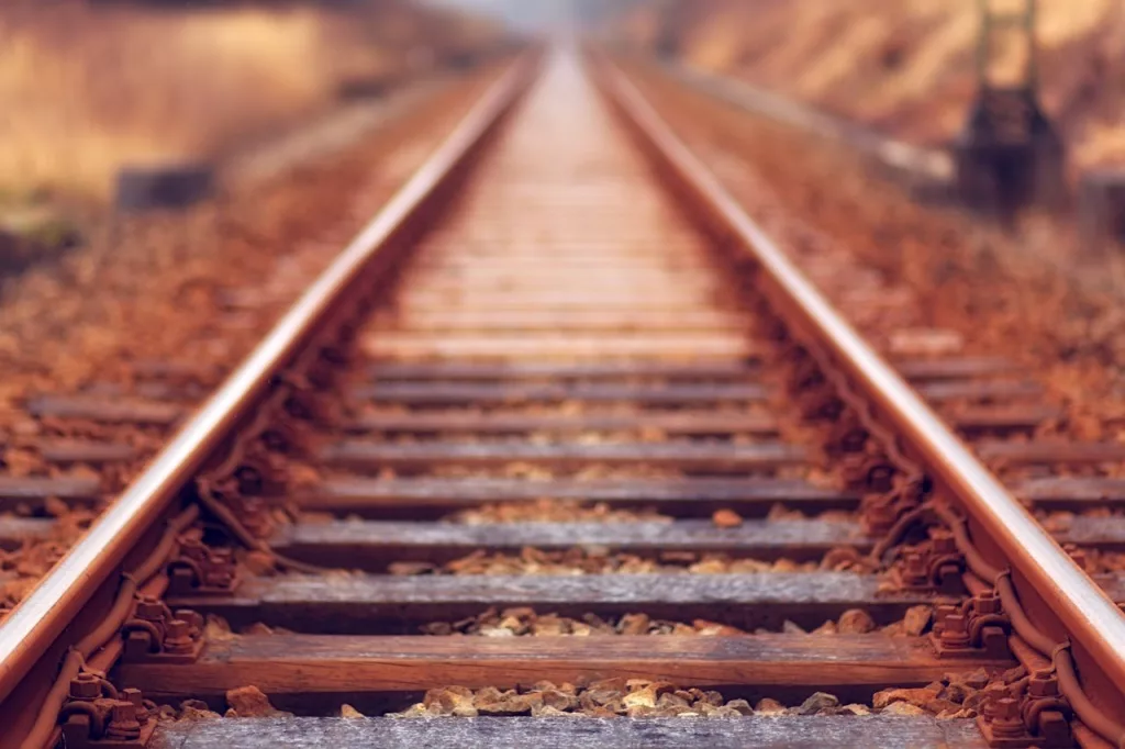 Close up photo of train rails.