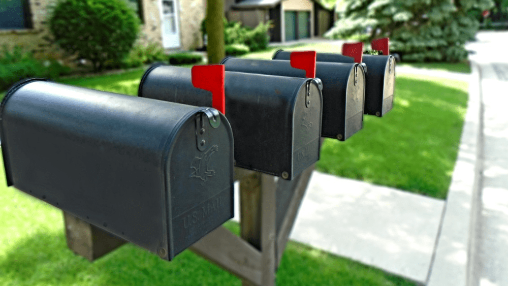 Four black mailboxes