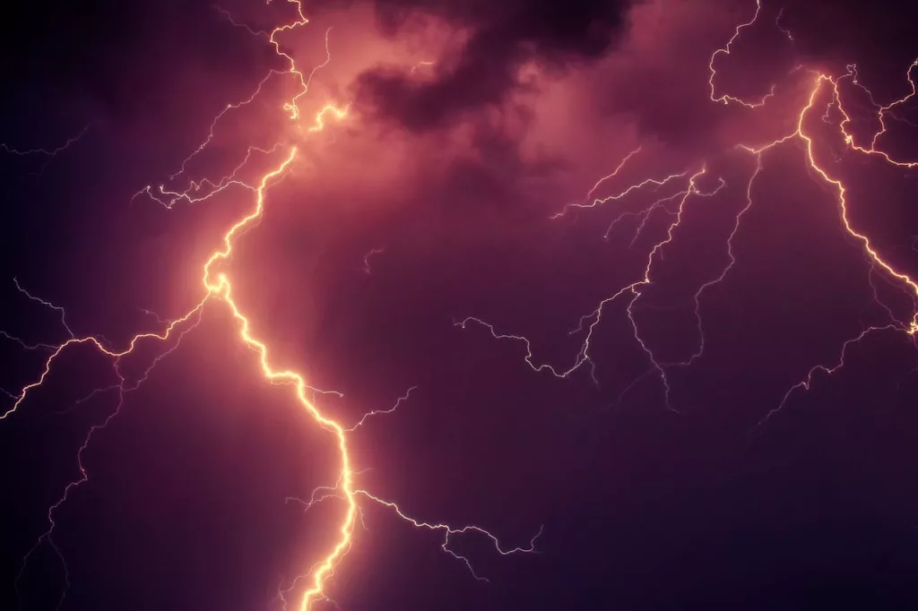 Photo shows lightning in the sky.