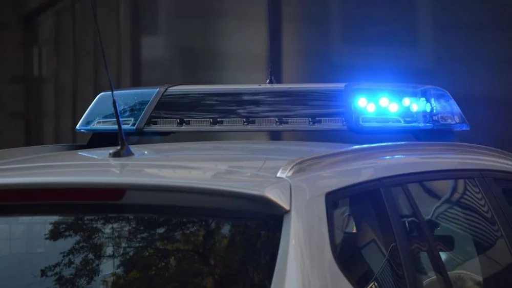 Police car with flashing blue lights