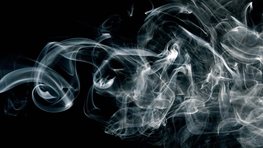 Smoke filtered over a black background