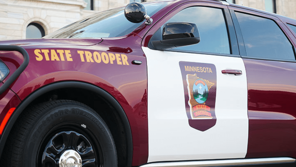 New Minnesota State Patrol Logo depicting a river winding through hills dappled by trees. A four pointed star hovers over the river and hills.