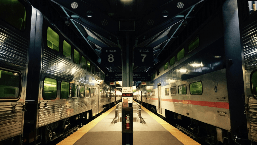 Two trains sitting at the station.