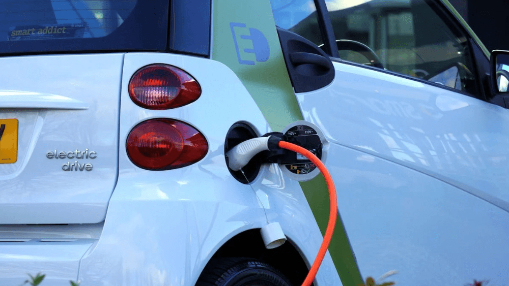 Stock image of electric vehicle at a charging station