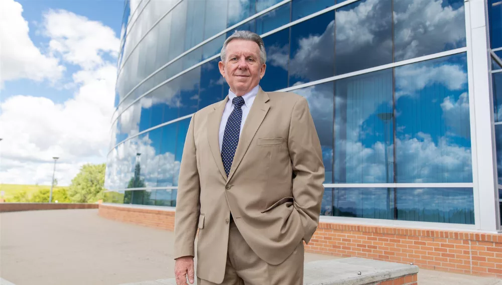 man in front of a building