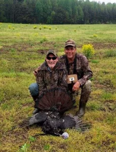 Master Sgt Eric Marts with Scott Goodman and a Tom Turkey at Heroes New Hope Foundation hunt.