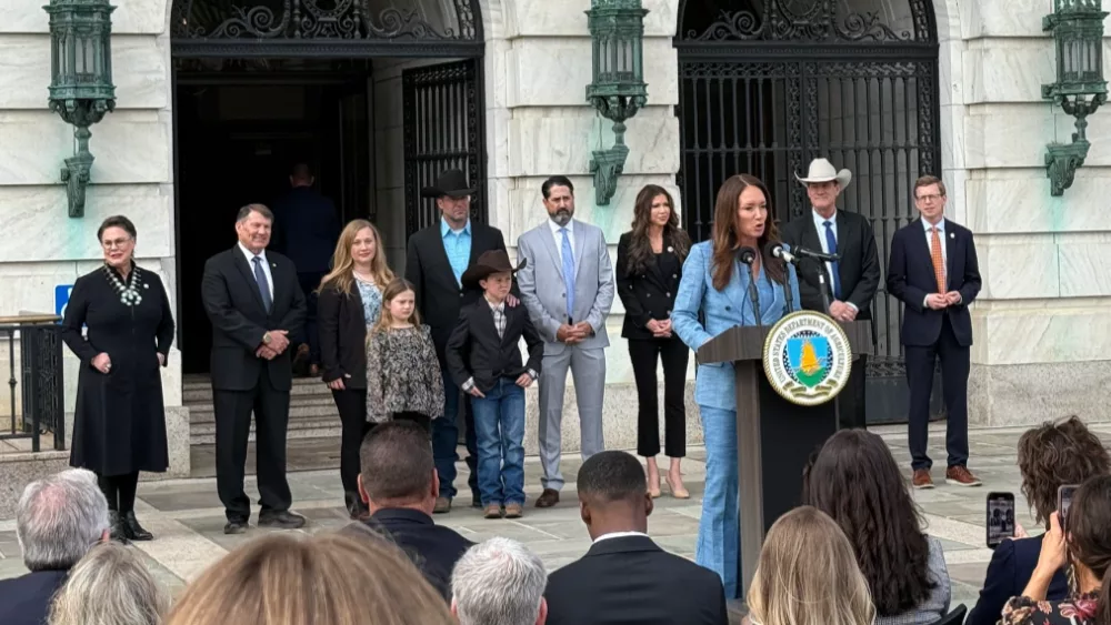 Image of Trump administration members speaking at a press conference with the Maude family in support of their land dispute with the federal government