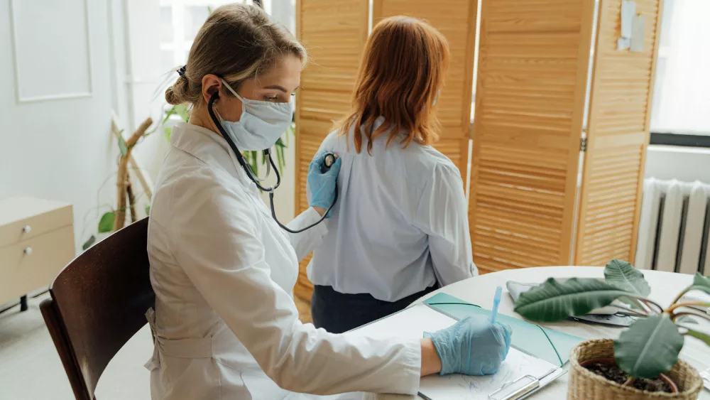 Image of doctor with patient at an office