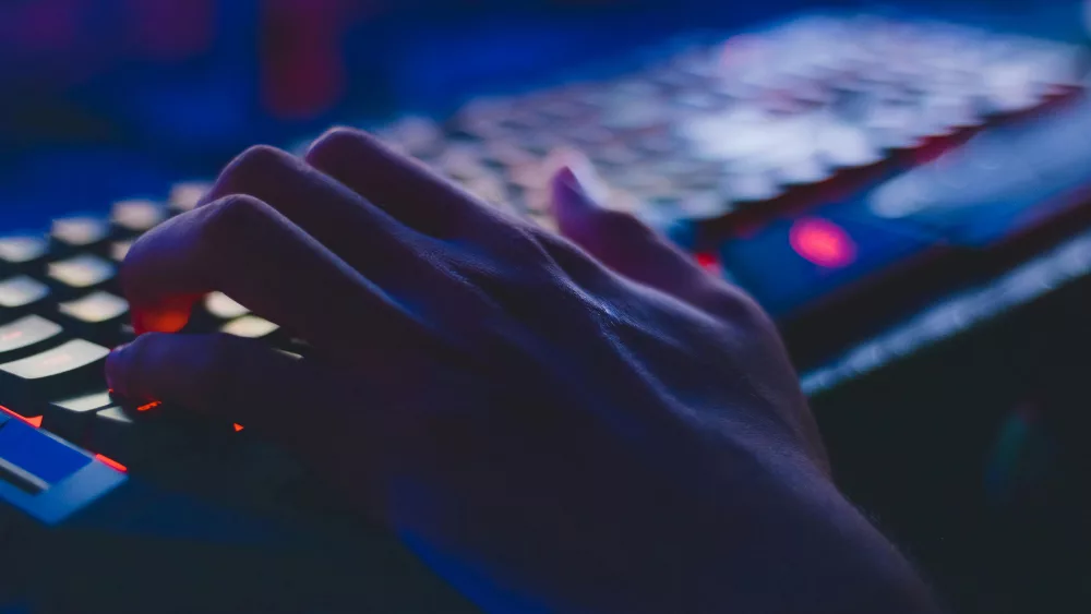 Image of hand on a computer keyboard