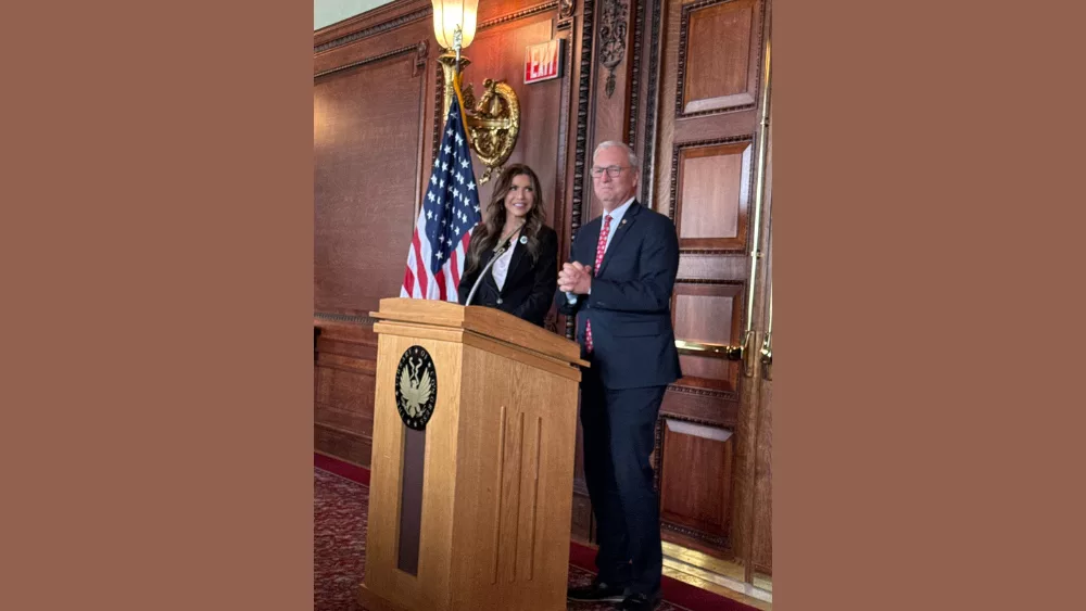 Kristi Noem and Kevin Cramer at a podium addressing the Chamber