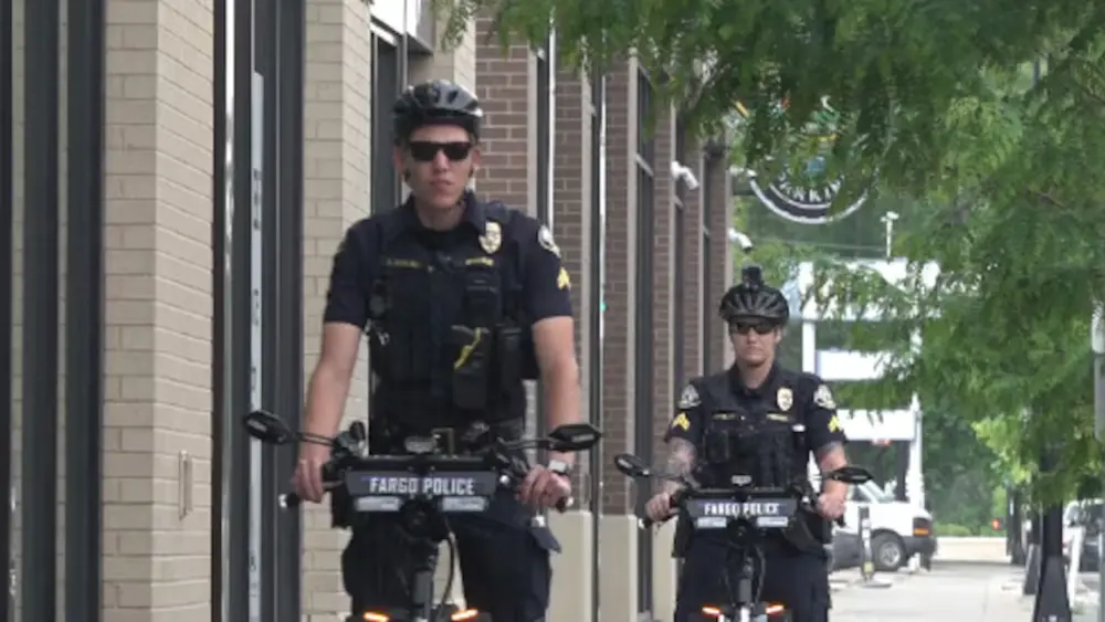 Image of two Fargo police officers riding their "trikkes"