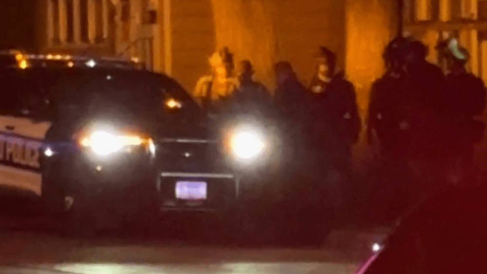 Image of SWAT team walking out with suspect