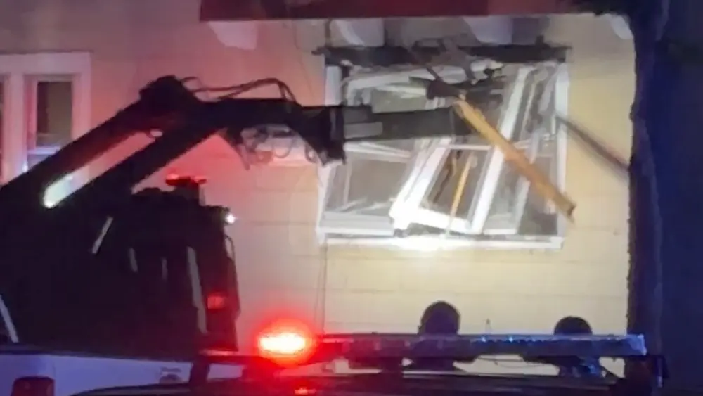 Image of "Rook" used by SWAT team to take out side window during attempts to get suspect out of home