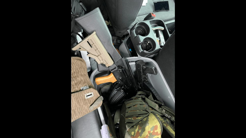 Image of inside of Vance Boelter's car showing guns inside