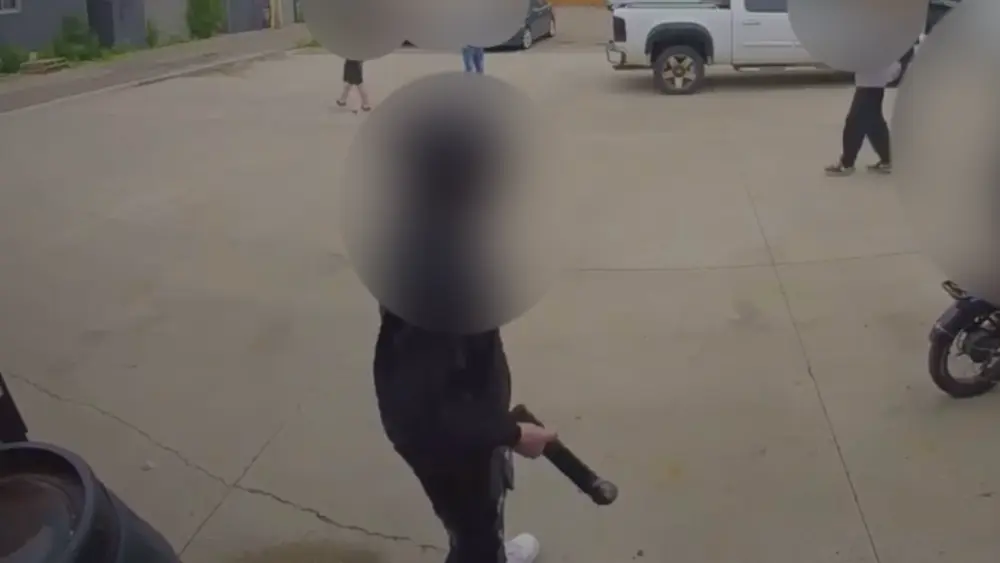Image of person grabbing metal object