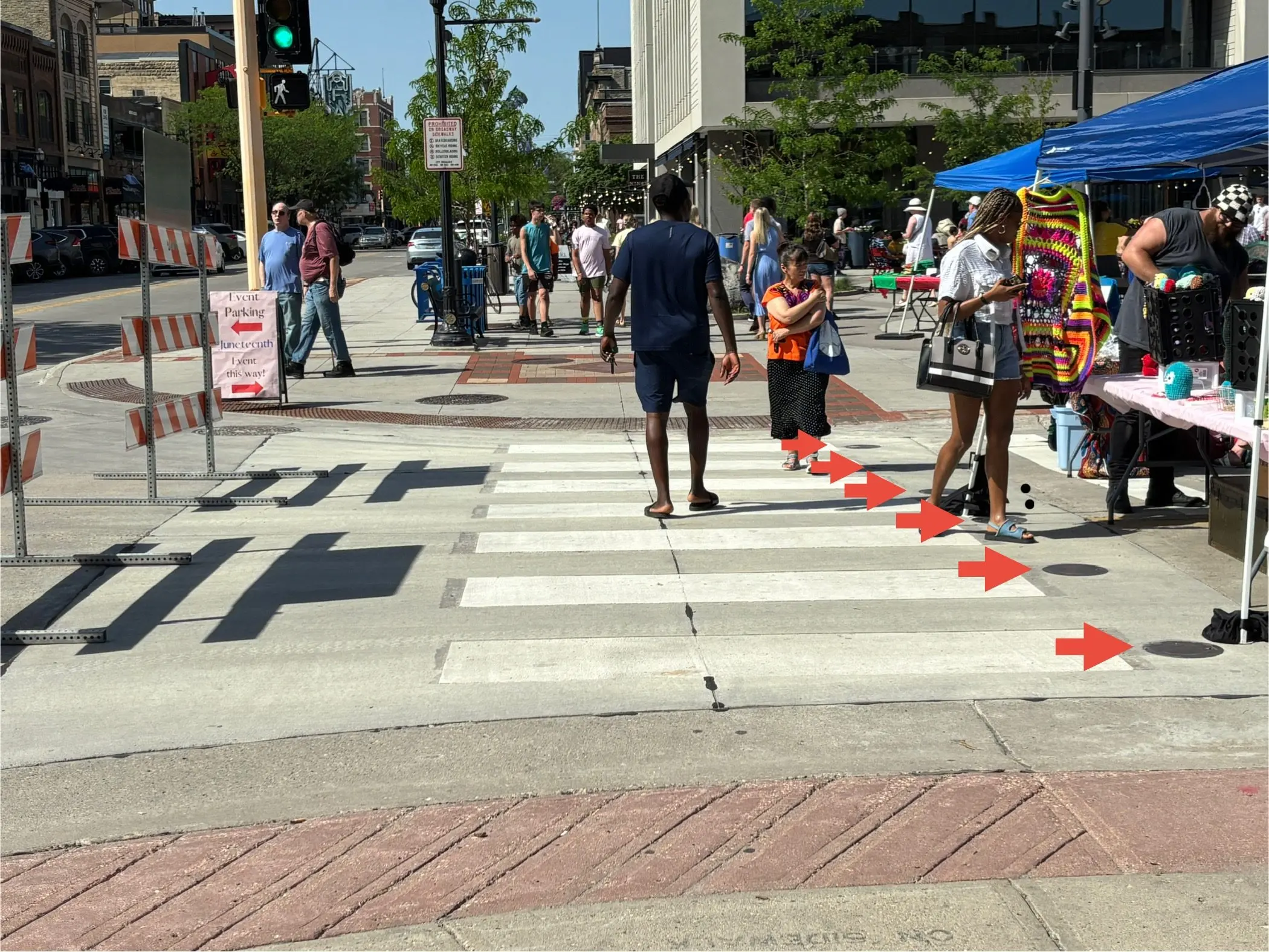 Image showing the crosswalk at 2nd Avenue North and Broadway with arrows pointing to the places where bollards can be installed
