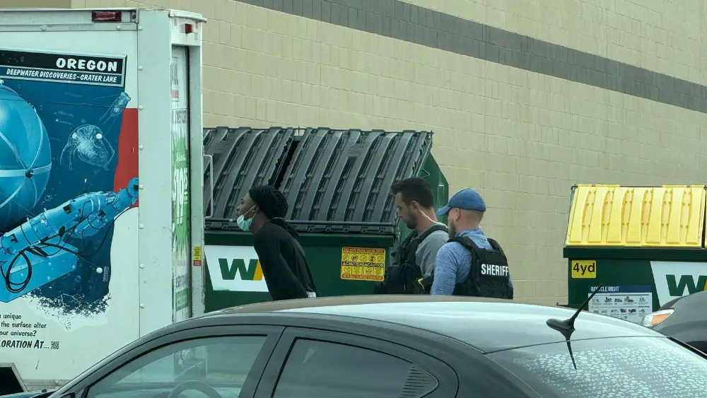 Image of suspect in the middle of arrest in Moorhead