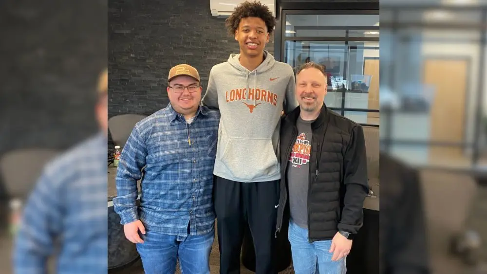 Three guys smiling for a photo