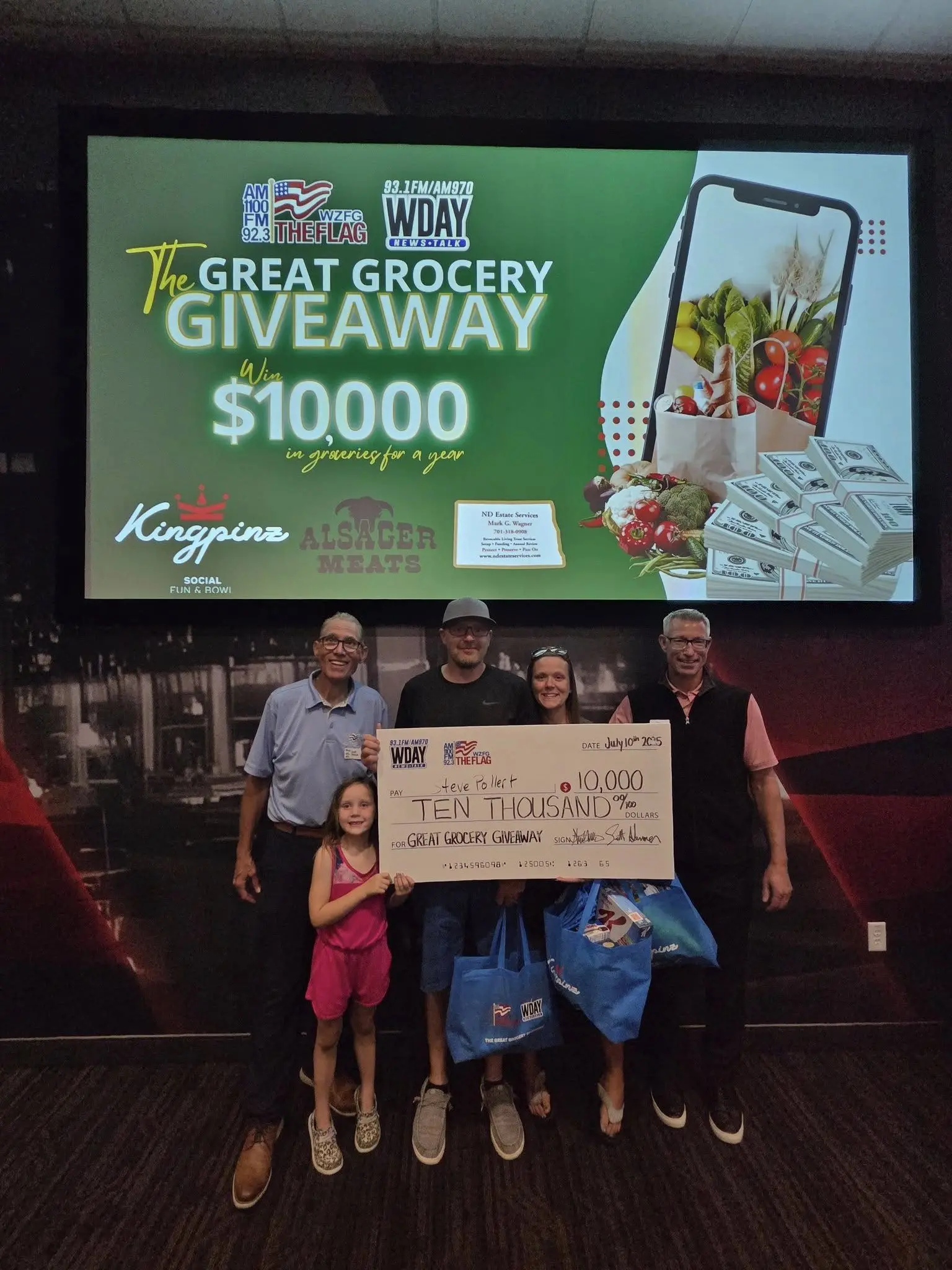 Image of Steven Pollert posing for a picture after winning the Great Grocery Giveway