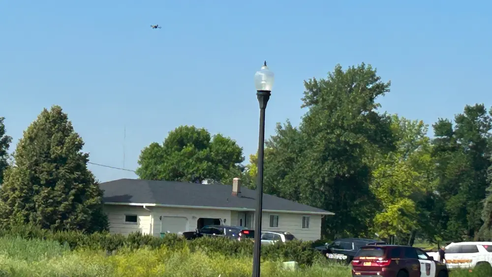 Image of drone flying above a home during the standoff in Moorhead
