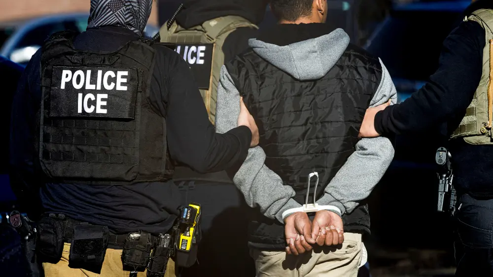 Image of ICE agents making an arrest