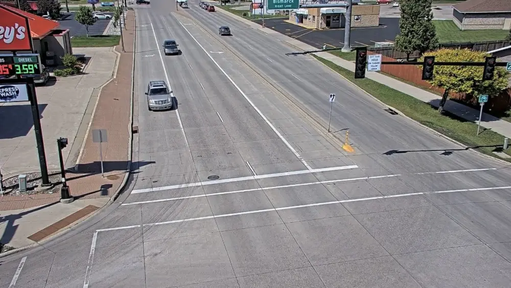 A screenshot of traffic camera footage showing two vehicles (top of image) crashing at 25th Street South and the tail end of the off ramp from I-94 eastbound on June 28 2025