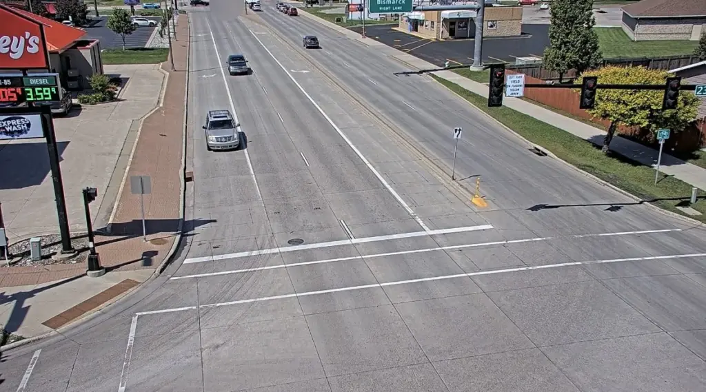 A screenshot of traffic camera footage showing two vehicles (top of image) crashing at 25th Street South and the tail end of the off ramp from I-94 eastbound on June 28 2025