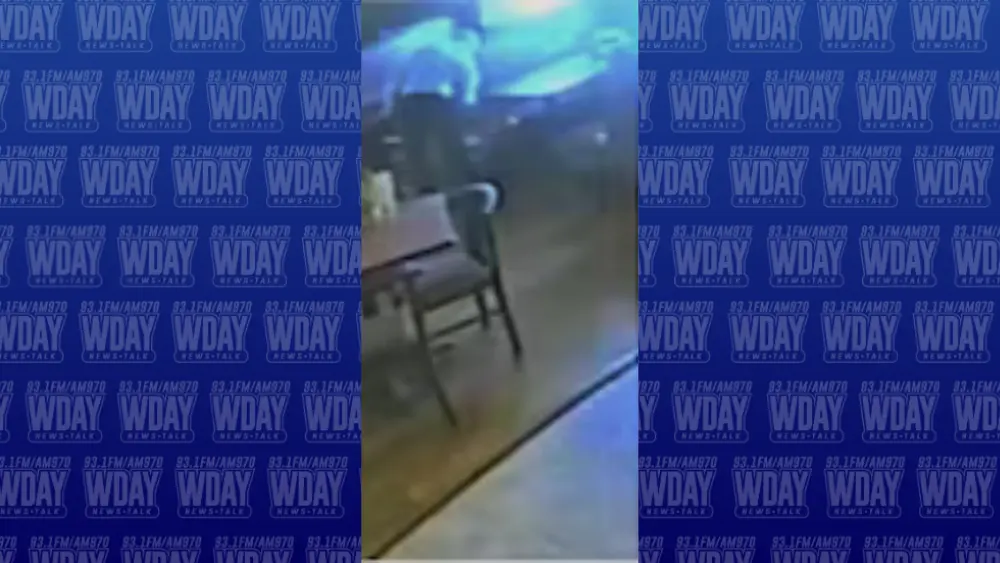 Image of man trying to set a table on fire at the El Valle Taco Shop