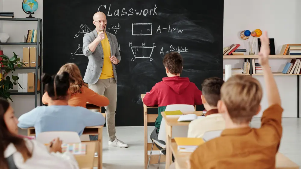 Image of teacher with students