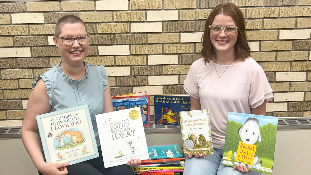 Donated books, Megan Krueger and Jayde Proffitt