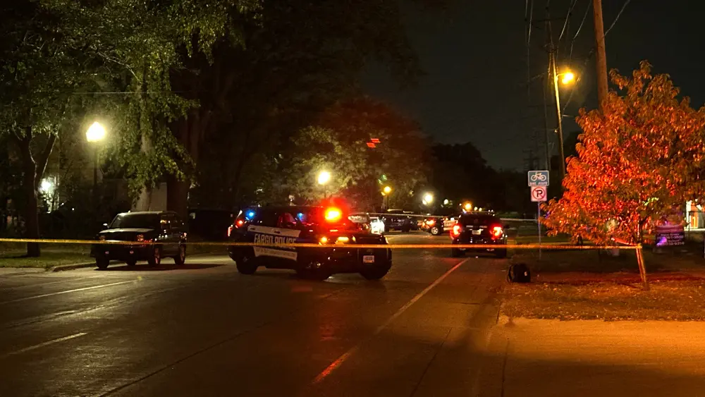 crime scene tape and squad car